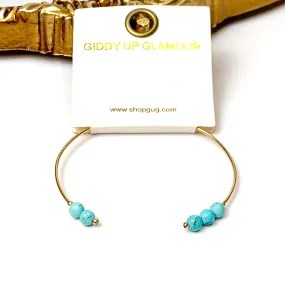 Thin Wire Bangle with Beaded Turquoise Ends in Gold Tone