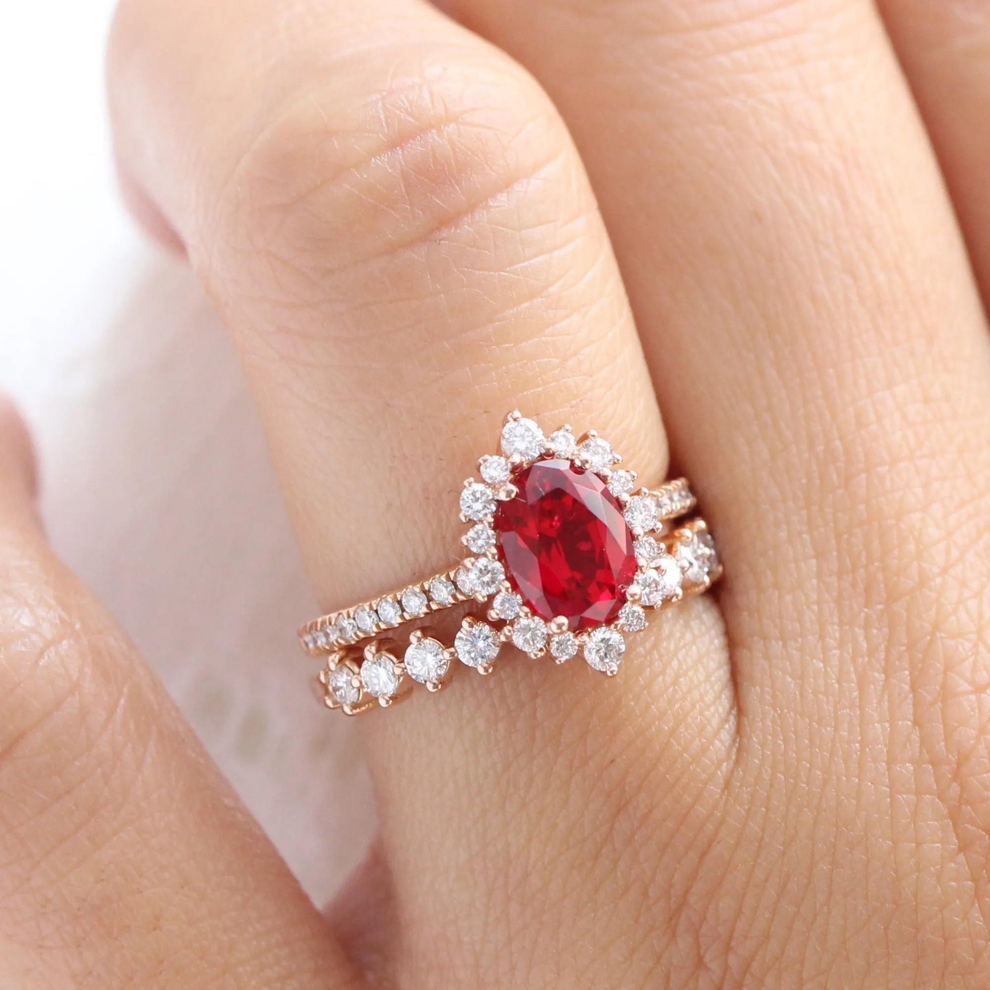Tiara Halo Oval Ruby Bridal Ring Set w/ Half Eternity Diamond Wedding Band