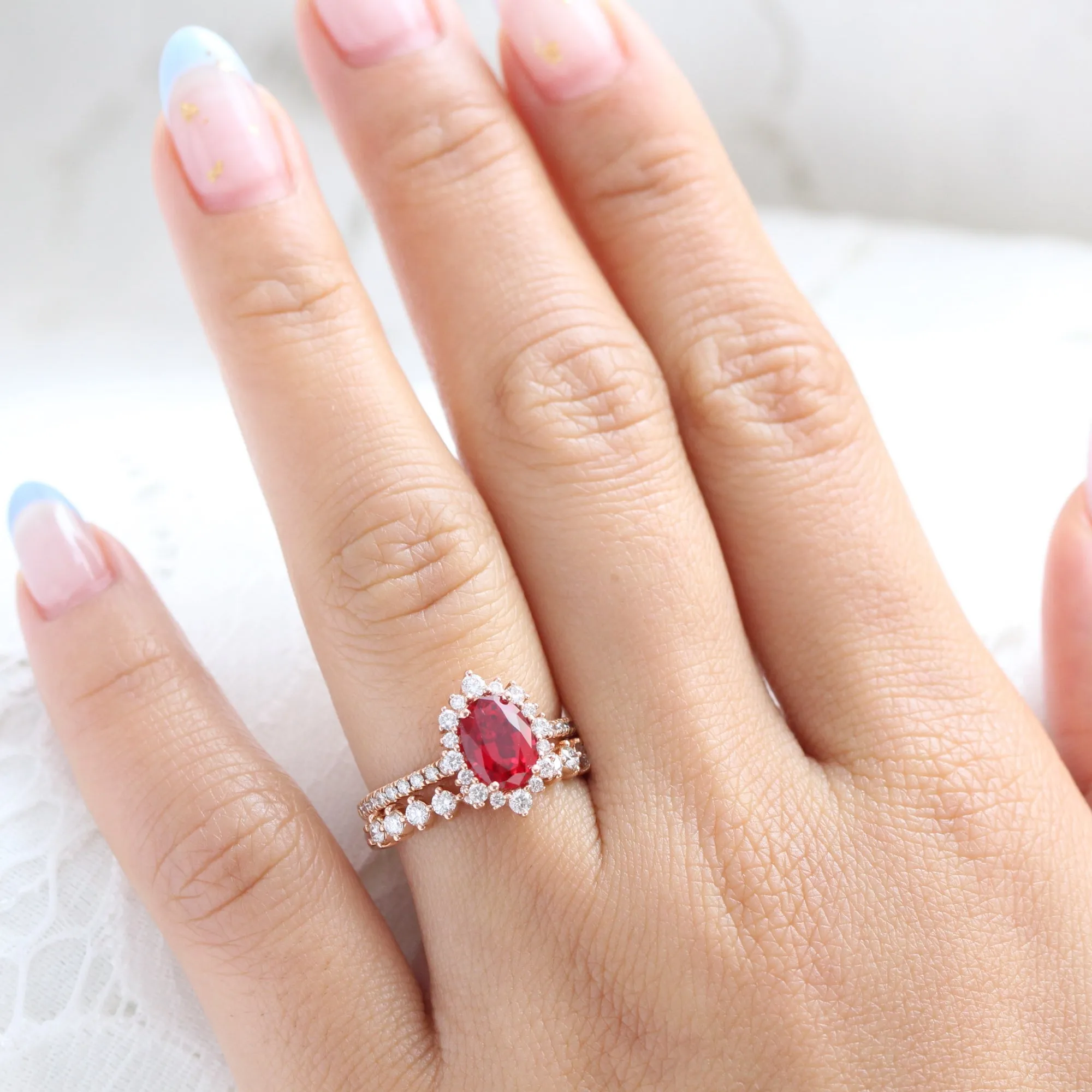 Tiara Halo Oval Ruby Bridal Ring Set w/ Half Eternity Diamond Wedding Band