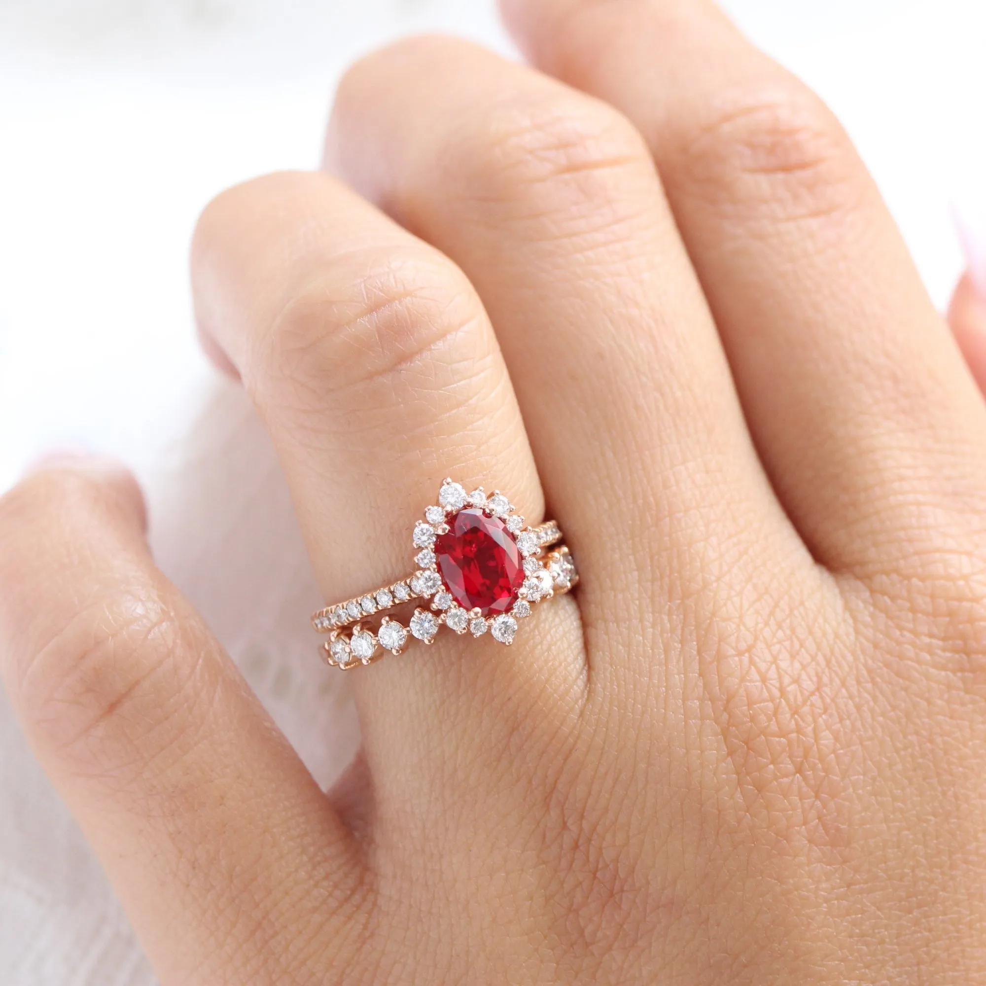 Tiara Halo Oval Ruby Bridal Ring Set w/ Half Eternity Diamond Wedding Band